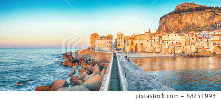 Outstanding evening cityscape of Cefalu city. 88251993