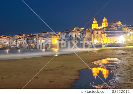Astonishing evening cityscape of Cefalu city. 88252011
