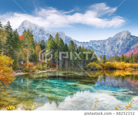 Stunning autumn scene of sunny morning on Almsee lake. Poppular travell destination. 88252152