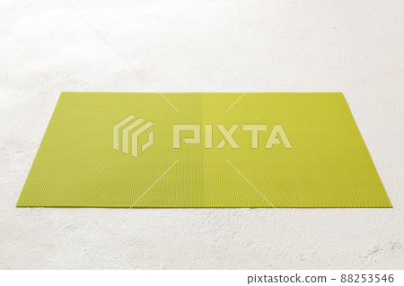 Perspective view of green tablecloth for food on cement background. Empty space for your design 88253546