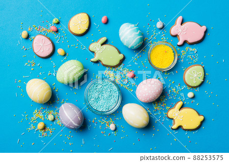 holiday preparation Multi colors Easter eggs with cookies on colored background . Pastel color Easter eggs. holiday concept with copy space 88253575
