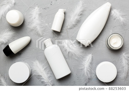 Spa cosmetic product, cream jar, branding mock up, top view with feathers background. Flat lay Spa cosmetic product, cream jar, branding mock up, top view with feathers background. Flat lay 88253603