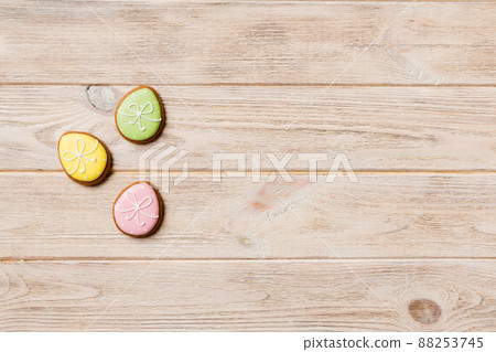 holiday preparation Multi colors Easter eggs with cookies on colored background . Pastel color Easter eggs. holiday concept with copy space holiday preparation Multi colors Easter eggs with cookies on colored background . Pastel color Easter eggs. holiday concept with copy space 88253745