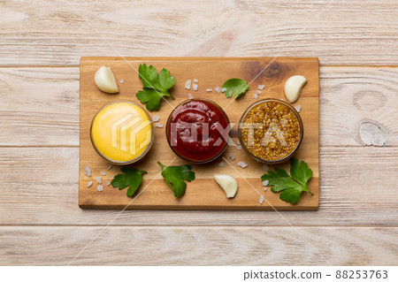 Many different sauces and herbs on table, flat lay top view. sauces on plate, healthy concept Many different sauces and herbs on table, flat lay top view. sauces on plate, healthy concept 88253763