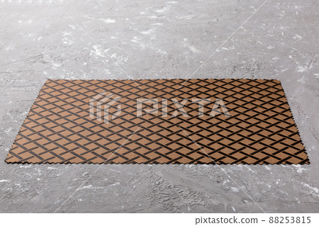 Perspective view of brown tablecloth for food on cement background. Empty space for your design Perspective view of brown tablecloth for food on cement background. Empty space for your design 88253815