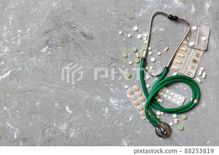Medical background. Many different various medicine tablets or pills on the table with stethoscope. Close up. Healthcare pharmacy and medicine concept Medical background. Many different various medicine tablets or pills on the table with stethoscope. Close up. Healthcare pharmacy and medicine concept 88253819