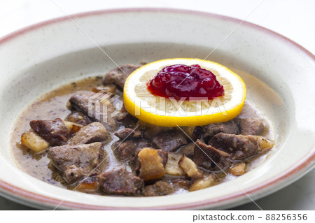 venison goulash with lemon and cranberries 88256356