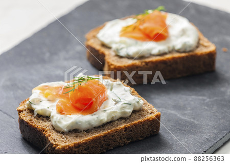whole grain bread with dill spread and smoked salmon whole grain bread with dill spread and smoked salmon 88256363