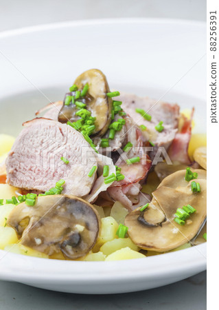 veal roll in bacon with mushroom sauce and potatoes veal roll in bacon with mushroom sauce and potatoes 88256391