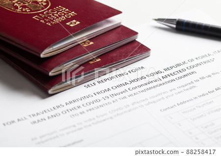 Passports and self reporting form for all travellers Passports and self reporting form for all travellers 88258417