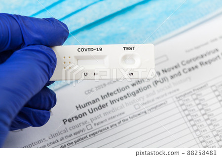 Doctor holding serological COVID-19 test Doctor holding serological COVID-19 test 88258481