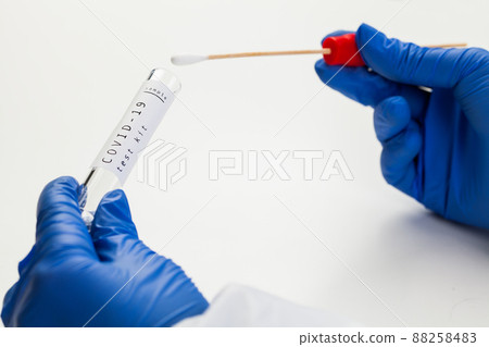 Doctor holding PCR COVID-19 test 88258483