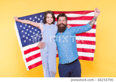 We live under the flag. Father and little child holding  We live under the flag. Father and little child holding  88258790
