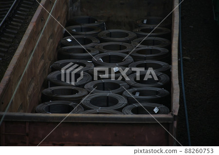 Cargo in the wagons of the train. Rail warehouse for loading materials Cargo in the wagons of the train. Rail warehouse for loading materials 88260753