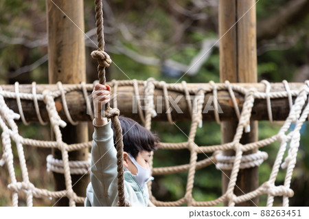 Boy playing well in the park Boy playing well in the park 88263451