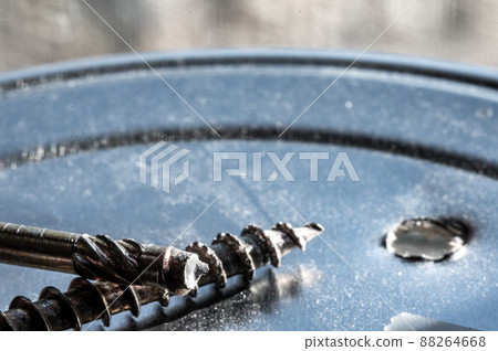 Screw with sheared threading after stress failure next to an intact example Screw with sheared threading after stress failure next to an intact example 88264668