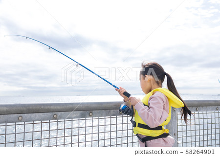 Girl enjoying fishing 88264901