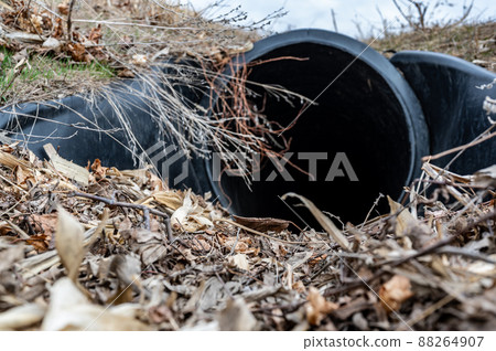 HDPE drainage culvert under a road entrance. Pipe is used to convey stormwater between ditches. 88264907