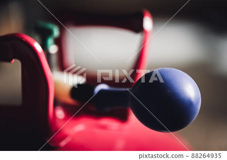 Selective focus on edge of an inflatable balloon attached to a helium canister. Selective focus on edge of an inflatable balloon attached to a helium canister. 88264935