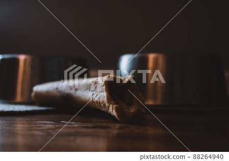 Side view of a dog chew bone with a metal bowl Side view of a dog chew bone with a metal bowl 88264940