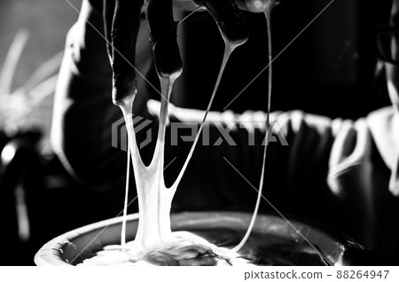 focus on slime covered hands with strings of gooey webbing down focus on slime covered hands with strings of gooey webbing down 88264947