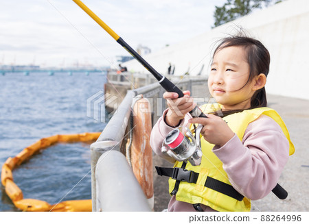 Girl enjoying fishing 88264996