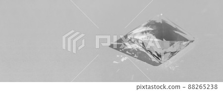 Crystal prism with light diffraction of spectrum colours and reflection with trendy light and hard shadows on a white background. Light spectrum reflected through glass prism Crystal prism with light diffraction of spectrum colours and reflection with trendy light and hard shadows on a white background. Light spectrum reflected through glass prism 88265238