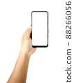 hand holding black smartphone isolated 88266056