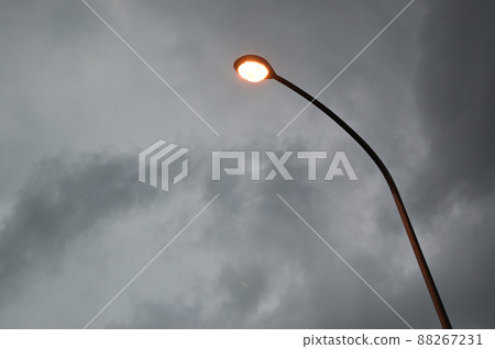 Streetlight in the dark clouds Streetlight in the dark clouds 88267231