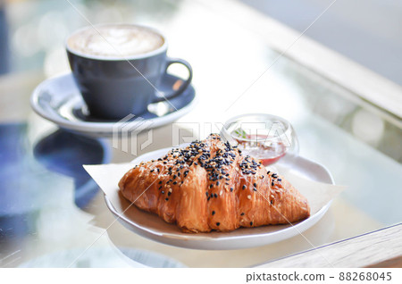 croissant , French croissant or French bread with sesame topping and coffee croissant , French croissant or French bread with sesame topping and coffee 88268045