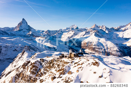 Winter Alpine landscape of Gornergrat ridge with observatory and Matterhorn mountain, Switzerland Winter Alpine landscape of Gornergrat ridge with observatory and Matterhorn mountain, Switzerland 88268348