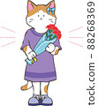 Girl kitten with a bouquet of carnations 88268369
