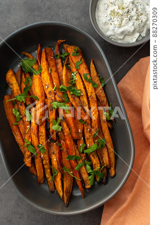 Oven baked orange sweet potato Oven baked orange sweet potato 88270309