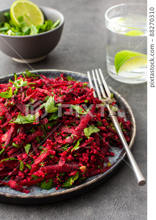 Salad with couscous and grated beets Salad with couscous and grated beets 88270310