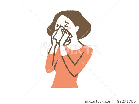A woman blowing her nose with a cold 88271799