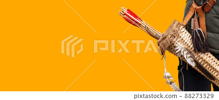Archer with Vintage Quiver and Wooden Arrows Isolated on Orange Background Archer with Vintage Quiver and Wooden Arrows Isolated on Orange Background 88273329
