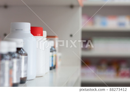 bottles on pharmacy store shelf bottles on pharmacy store shelf 88273412