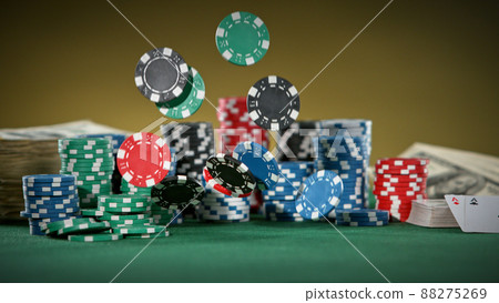 Falling poker chips on the table, macro shot 88275269