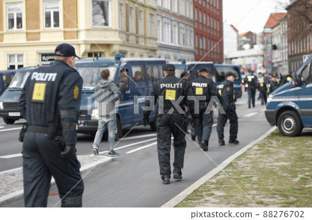 Ready for things to kick off. Shot of a group of police at a protest. 88276702