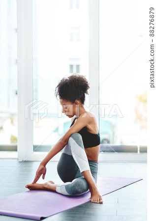 Youre only as good as you want to be. Shot of a beautiful young woman practising yoga in a studio. Youre only as good as you want to be. Shot of a beautiful young woman practising yoga in a studio. 88276879
