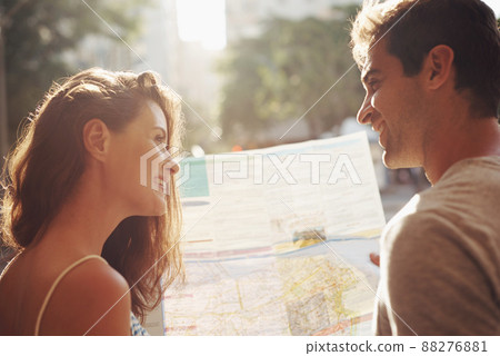 I love getting lost with you. Cropped shot of a young couple touring a foreign city. 88276881