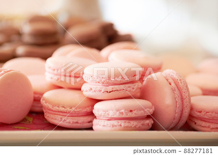 Freshly baked biscuits. Cropped shot of a fresh batch of pink macaroons. Freshly baked biscuits. Cropped shot of a fresh batch of pink macaroons. 88277181
