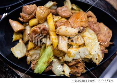 Stir-fried chicken ribs with chicken, cabbage, vegetables, spicy seasoning, and tteokbokki, traditional Korean food Stir-fried chicken ribs with chicken, cabbage, vegetables, spicy seasoning, and tteokbokki, traditional Korean food 88277420