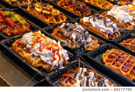 Belgian waffles with colorful toppings on showcase. Brussels Belgian waffles with colorful toppings on showcase. Brussels 88277790