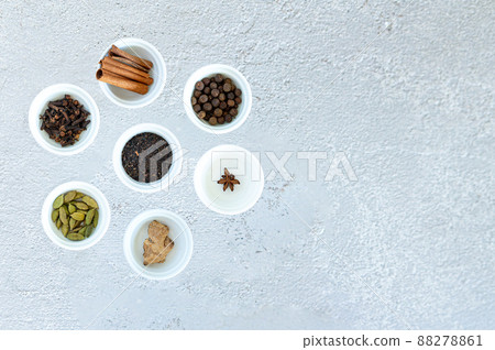 Ingredients for Indian masala tea on gray background 88278861