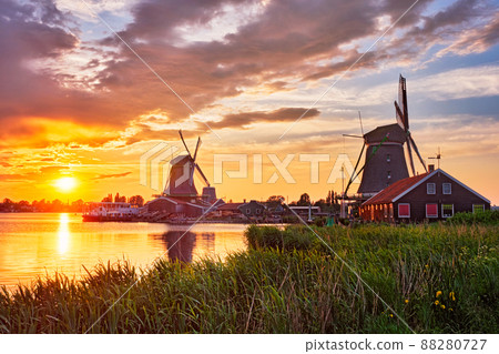 Windmills at Zaanse Schans in Holland on sunset. Zaandam, Nether 88280727