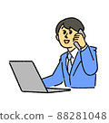 A businessman calling while watching a computer 88281048
