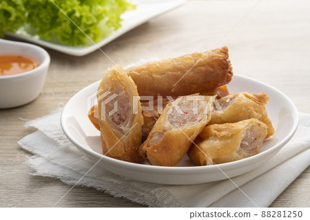 Deep fried spring roll with glass noodles on a white plate.Chinese Traditional Deep fried spring roll with glass noodles on a white plate.Chinese Traditional 88281250