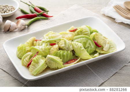 Stir-fried Baby Cabbage with Mushroom Soy Sauce in white plate.Healthy vegetarian food Stir-fried Baby Cabbage with Mushroom Soy Sauce in white plate.Healthy vegetarian food 88281266