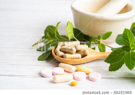 Alternative medicine herbal organic capsule drug with herbs leaf natural supplements for healthy good life. Alternative medicine herbal organic capsule drug with herbs leaf natural supplements for healthy good life. 88281968